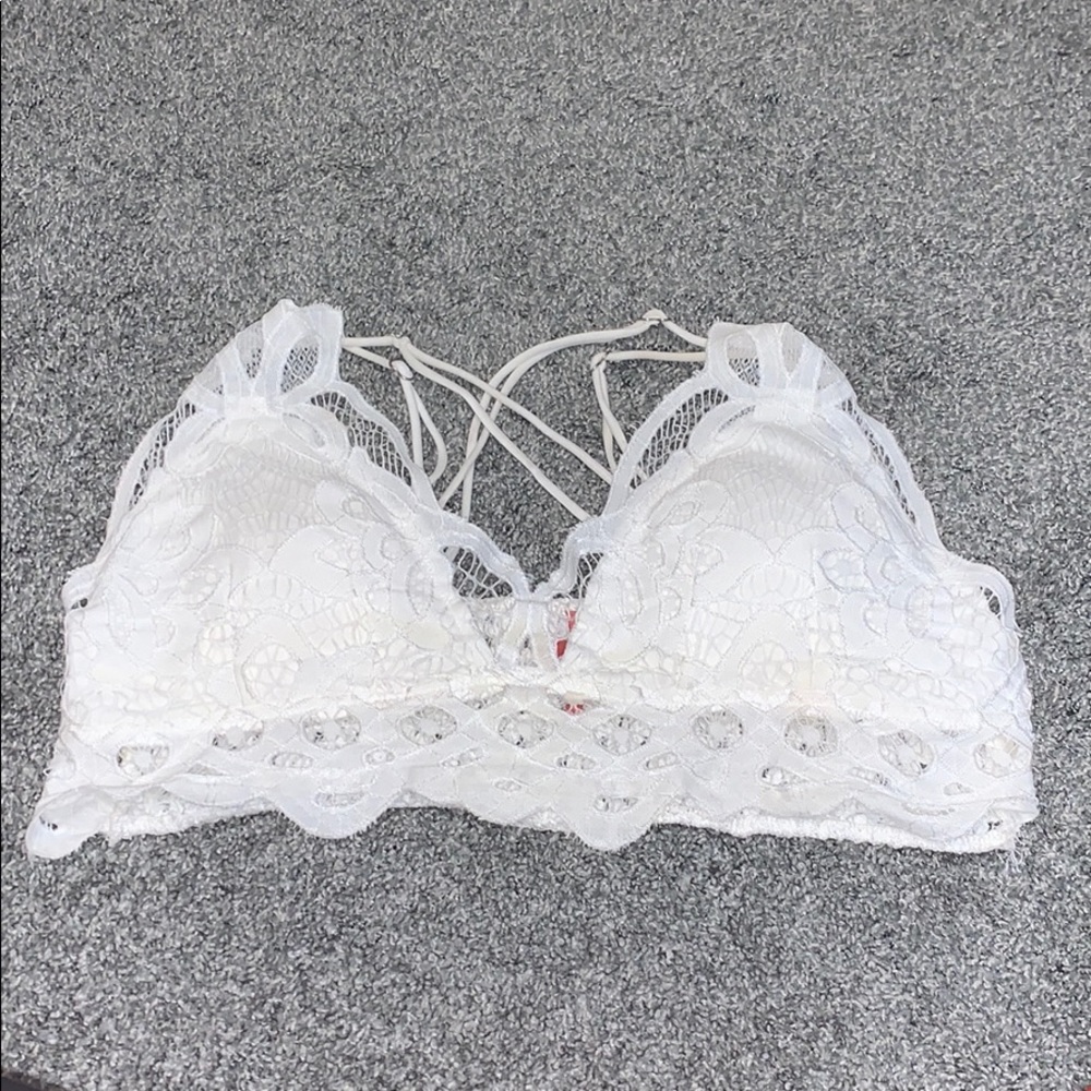 white lacey bralette with crisscross strap in back